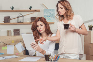 two women working together